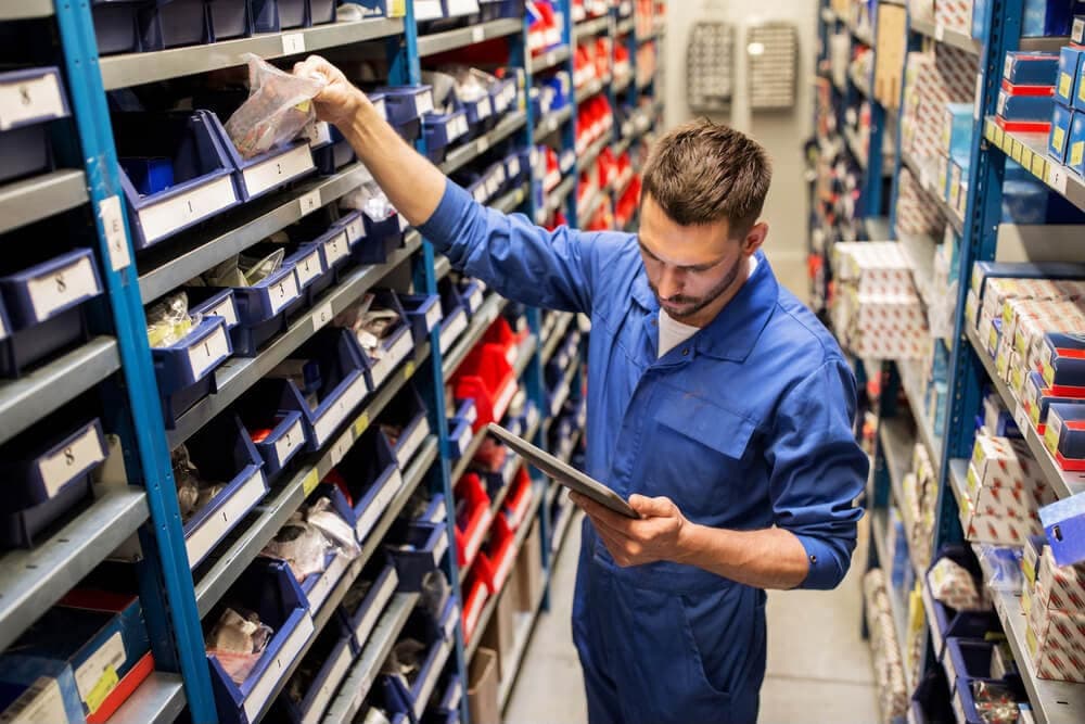 Technician checking parts inventory