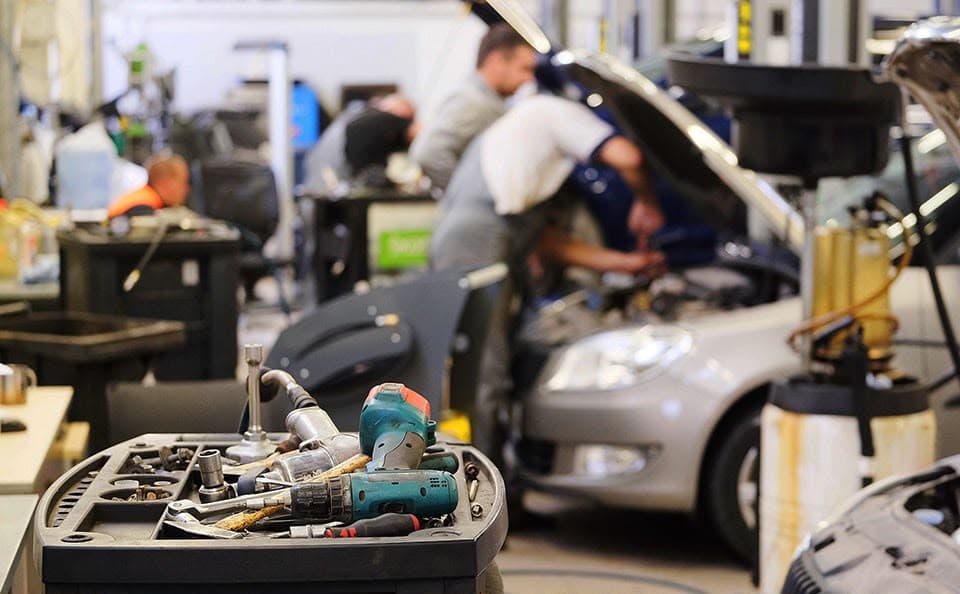 Service bay with mechanics at work