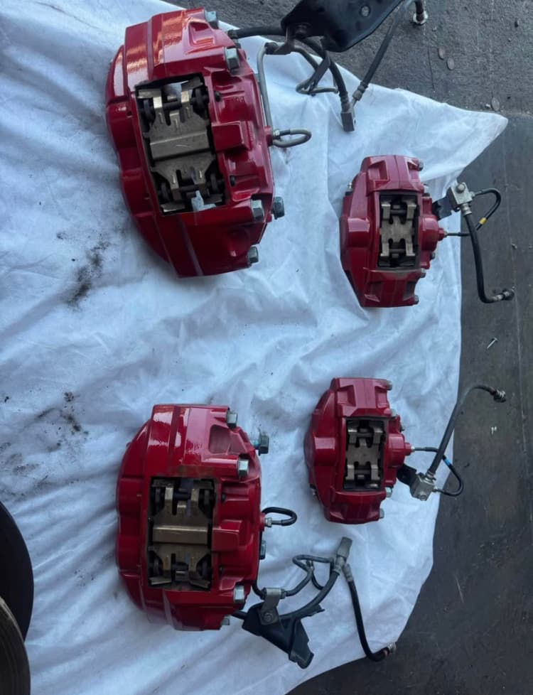 370Z/G37 Akebono Big Brake Calipers | High-Gloss Red Powder Coated | 2009-2020 Nissan 370Z & 2008-2013 Infiniti G37 Sport | 4-Piston Front & 2-Piston Rear | Genuine OEM Cores | Direct Bolt-On Upgrade
